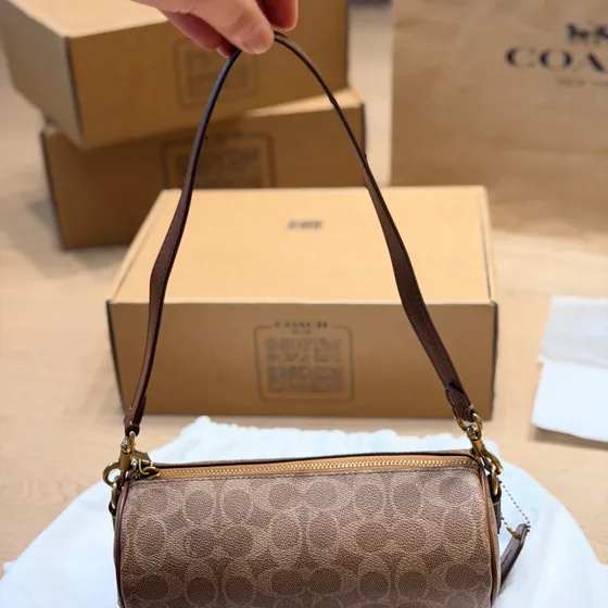 Coach Nolita Barrel Bag In Signature Kanvas Tan/Coklat Shoulder Bag