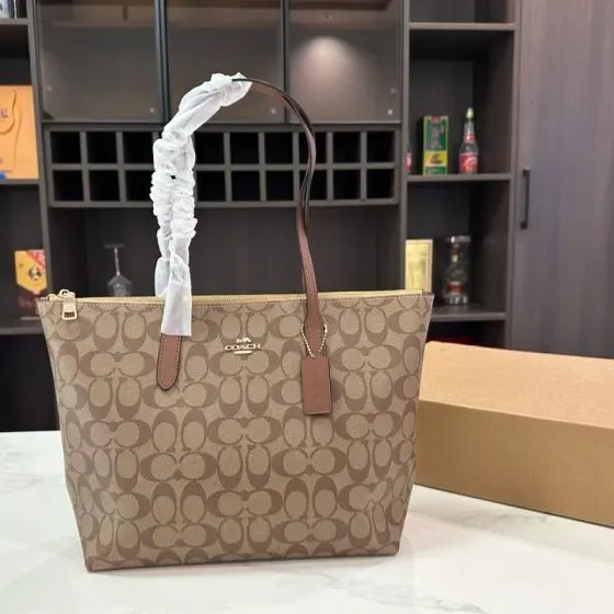 Coach Zip Top Tote In Signature Canvas Khaki Saddle Tote Bag