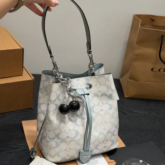 Coach Rowan Bucket Bag In Signature Canvas Pink White Signature Print Crossbody