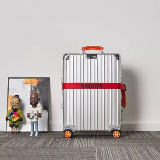Rimowa suitcase Silver with orange handles travel