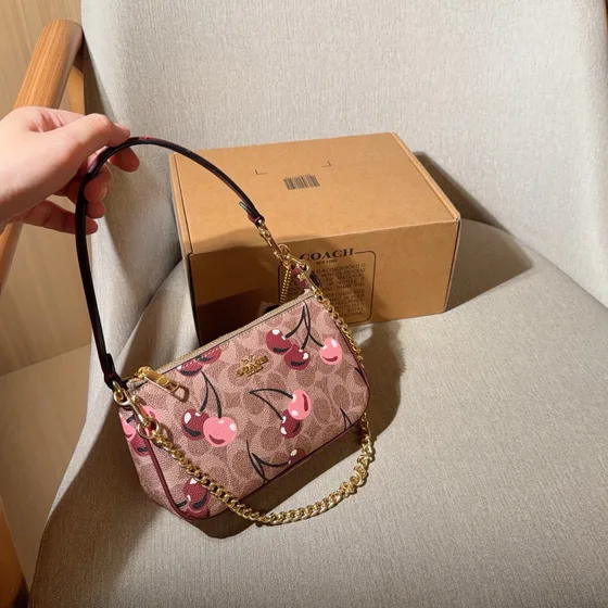 Coach Nolita 19 In Signature Canvas With Cherry Print Tan Pink 19cm length Woc