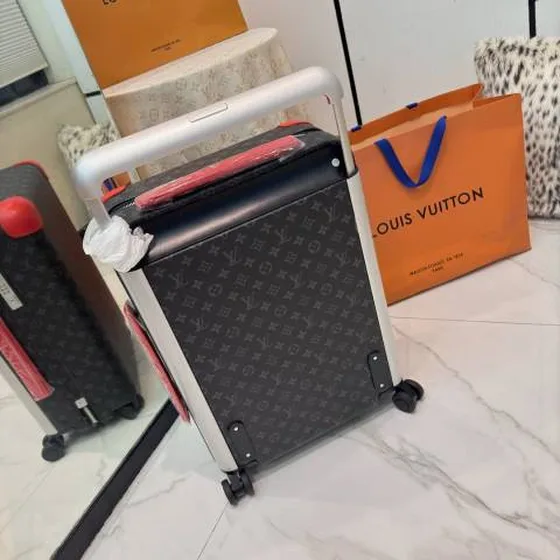 Louis Vuitton suitcase Monogram Eclipse with red trim travel