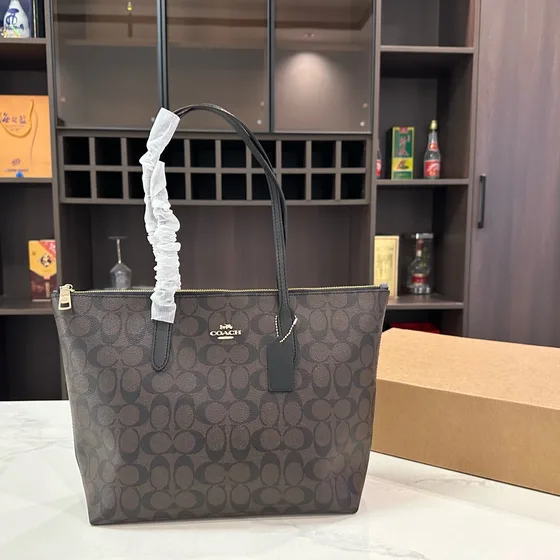 Coach Zip Top Tote In Signature Canvas Khaki Saddle Tote Bag