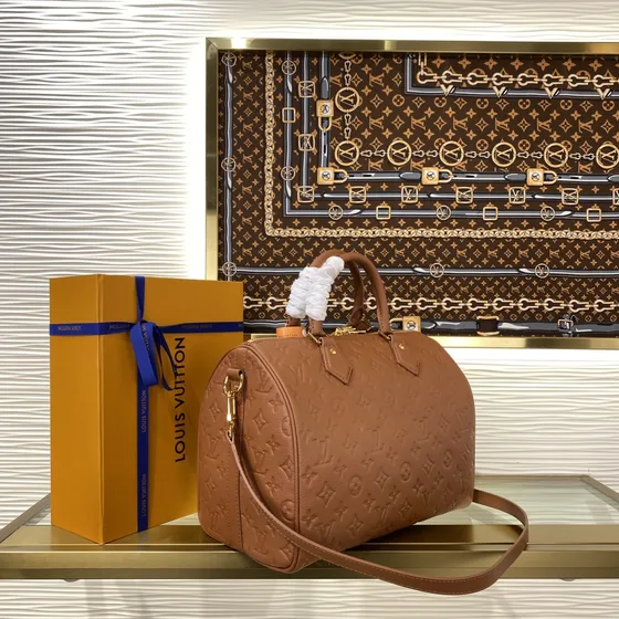 Louis Vuitton Speedy Bandoulière Brun Tophåndtag