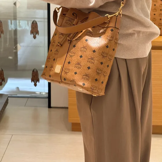 MCM Aren Visetos Drawstring Bucket Bag Cognac Crossbody