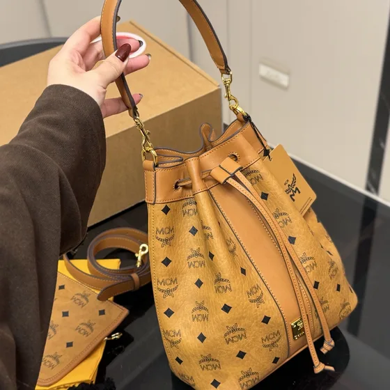 MCM Aren Visetos Drawstring Bucket Bag Cognac Crossbody